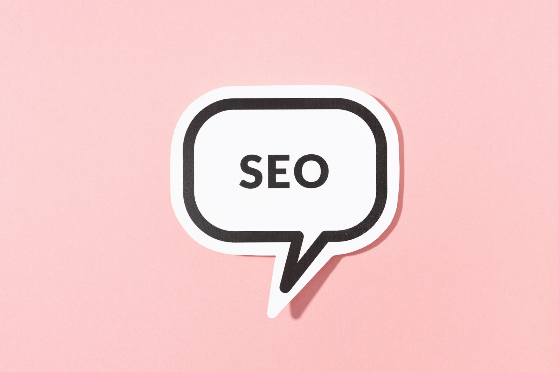 seo text on speech bubble isolated on pink background